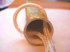 Feed the cord in the end of the tube out one of the holes around the tube then through the other hole then out of the end